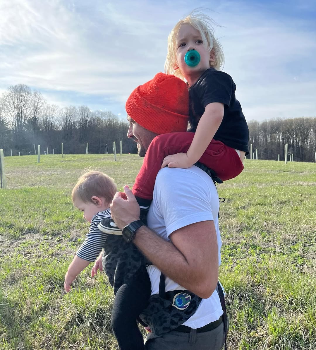James Ransone hoists Jack across his shoulders as he carries Violet in a baby carrier, from a post dated April 25, 2022. | Source: Instagram/skippermcphee