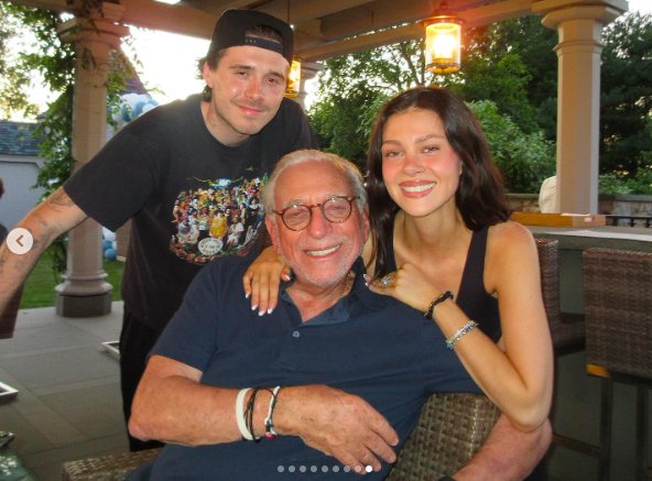 Brooklyn and Nicola Peltz Beckham smiling for the camera with Nelson Peltz. | Source: Instagram/nicolaannepeltzbeckham