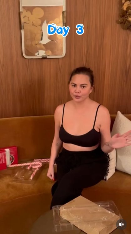 A Magical Prep Turns Toothy: That evening, Teigen readies the next candy cane upgrade &mdash; completely unaware that one wrong bite is about to cost her a veneer. | Source: Instagram/chrissyteigen