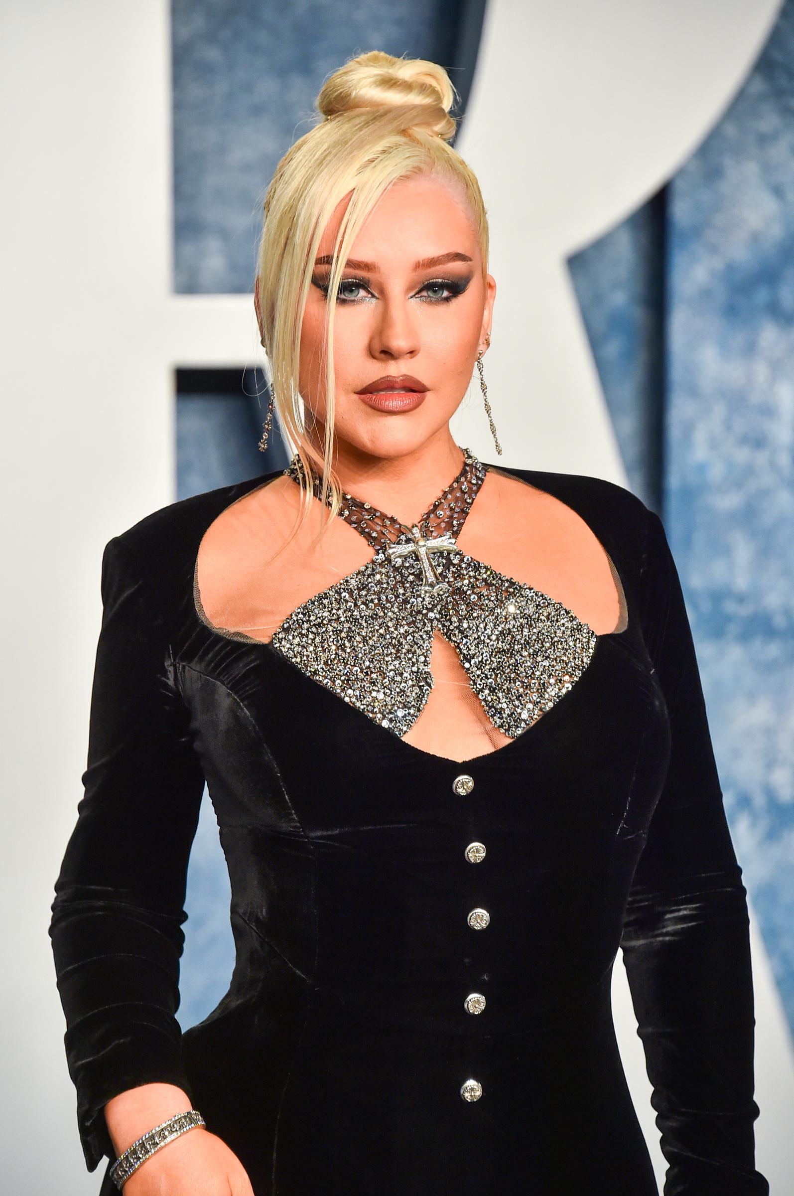 Christina Aguilera, 42, showed a full upper body, a supported bust, and an angular face, while arriving at the Vanity Fair Oscar Party held at the Wallis Annenberg Center for the Performing Arts on March 12, 2023, in Beverly Hills, California.