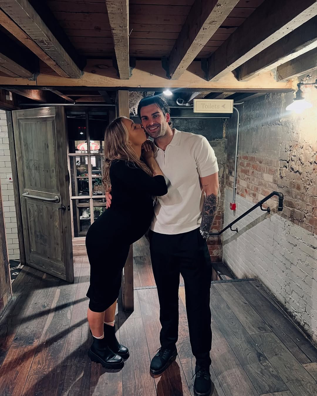 Laura Woods and Adam Collard pose for a photo posted on 14 December 2024. | Source: Instagram/adamcollard