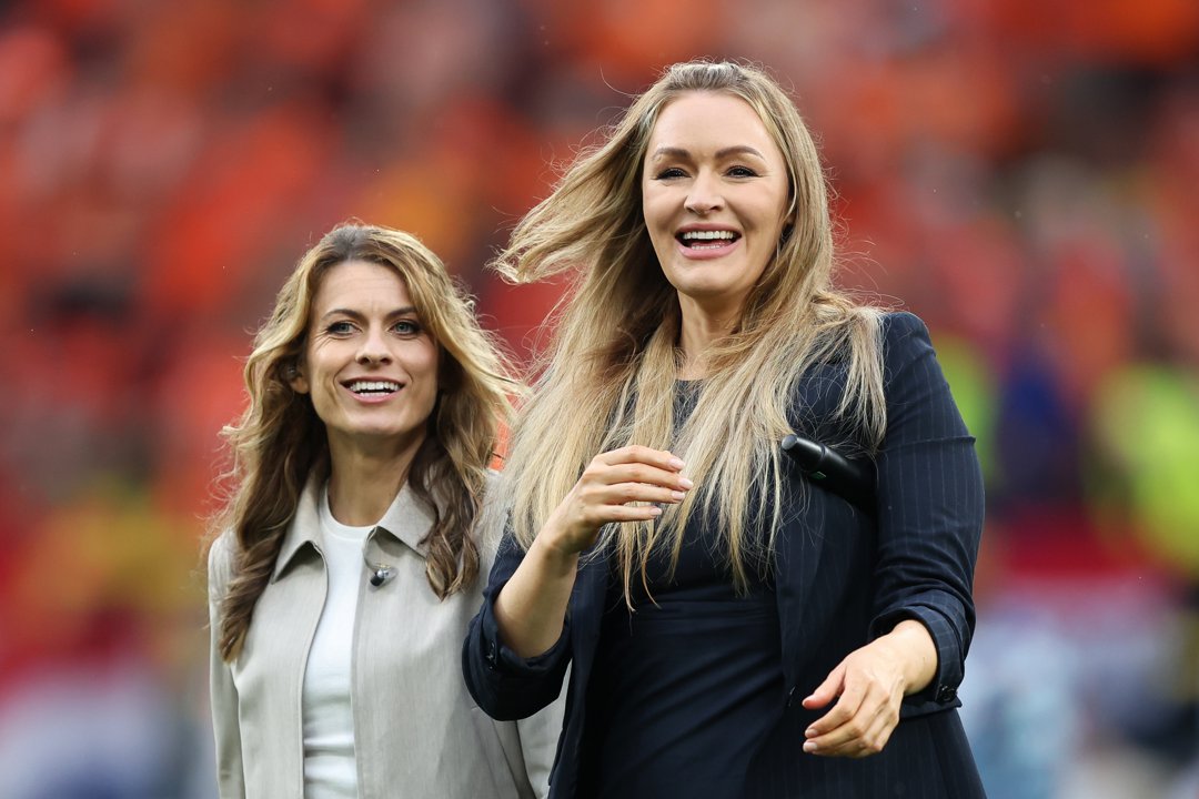 Karen Carney and Laura Woods react prior to the UEFA EURO 2024 semi-final match between Netherlands and England at Football Stadium Dortmund on 10 July 2024 in Dortmund, Germany. | Source: Getty Images