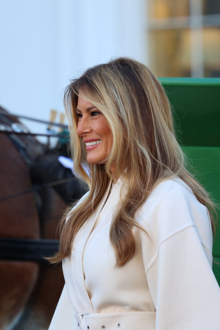 Melania Trump smiles for cameras as she welcomes the official Christmas tree. | Source: Getty Images