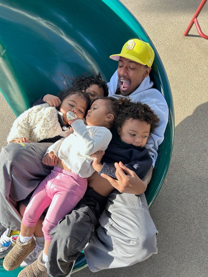 Nick Cannon and four of his younger children are photographed in a water slide from a post dated May 5, 2025. | Source: Facebook/NickCannon