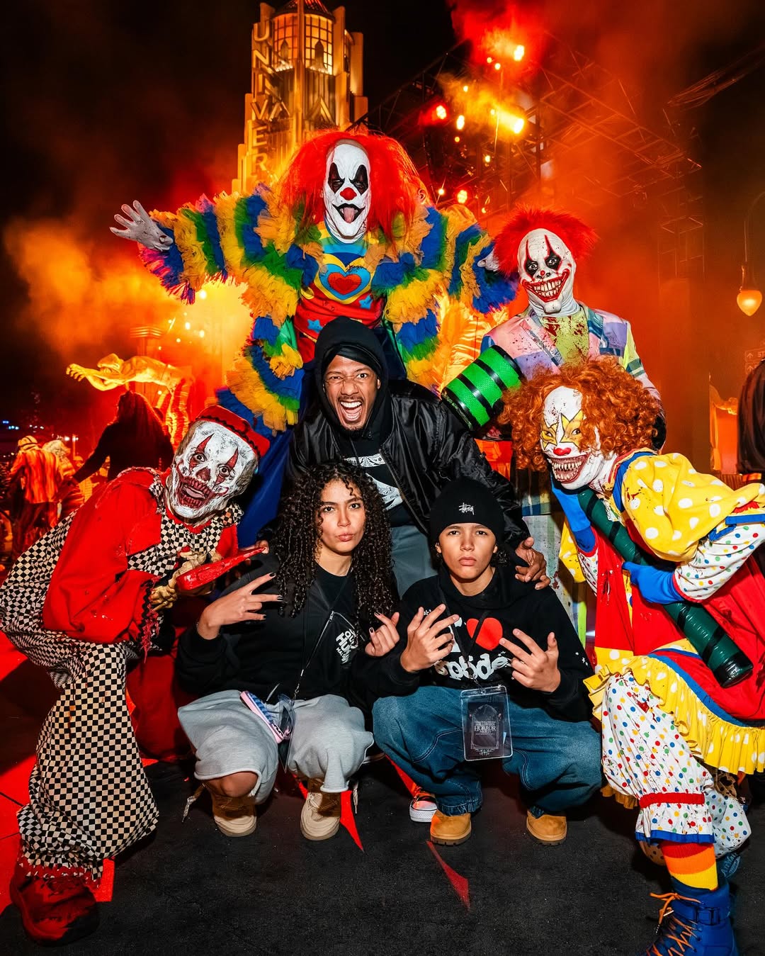 Nick, Monroe and Moroccan Cannon take photo with clowns from a post dated October 3, 2025. | Source: Instagram/nickcannon