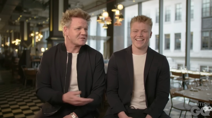 Gordon and Jack Ramsay were filmed sharing a laugh during a joint video interview for British GQ, dated June 1, 2019. Seated side by side in matching black jackets and white T-shirts, the pair offered rare insight into their relationship, with Jack holding his own alongside his famously outspoken father. | Source: YouTube/GQ