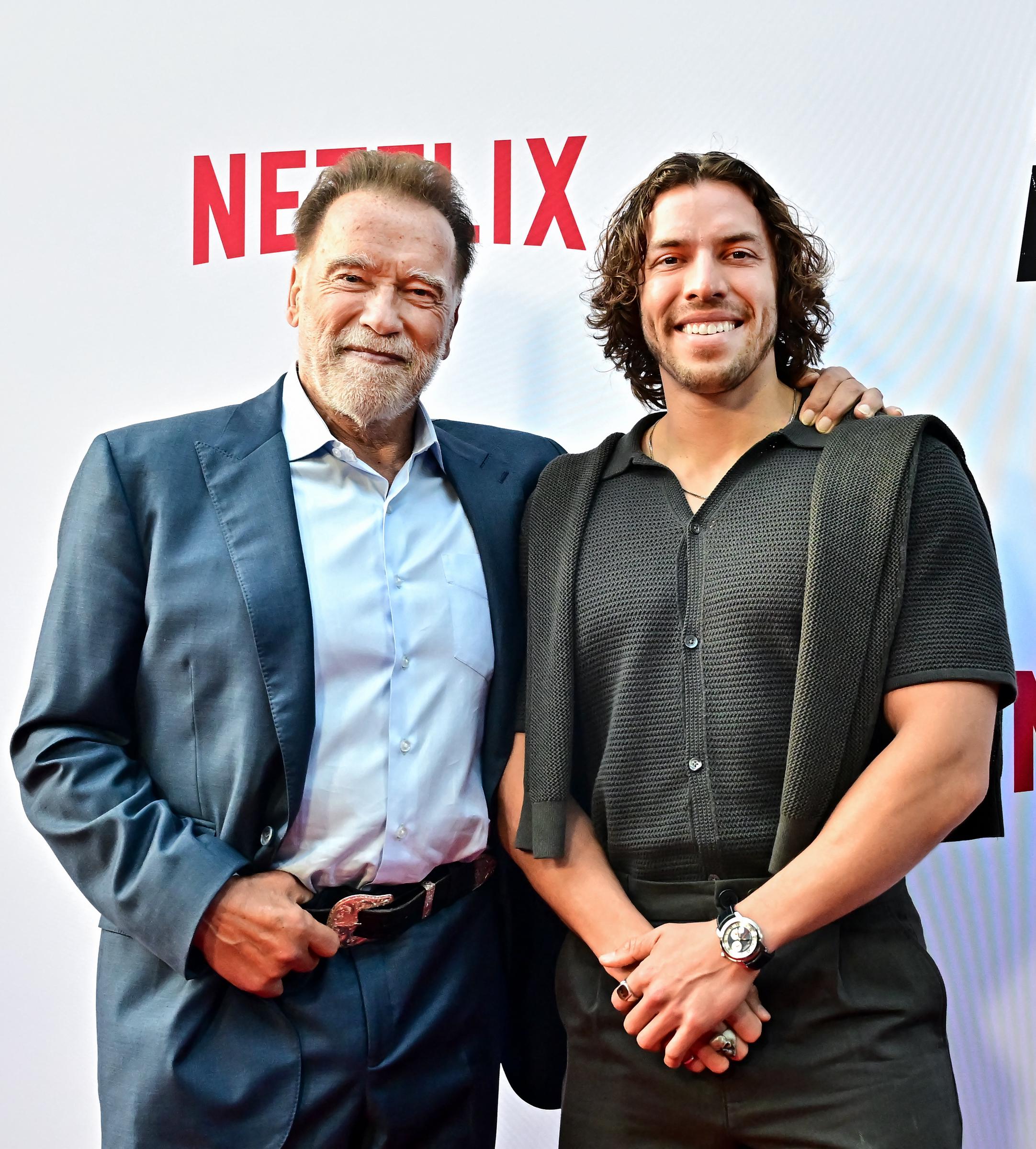 Arnold Schwarzenegger and son Joseph Baena attend the premiere of Netflix's
