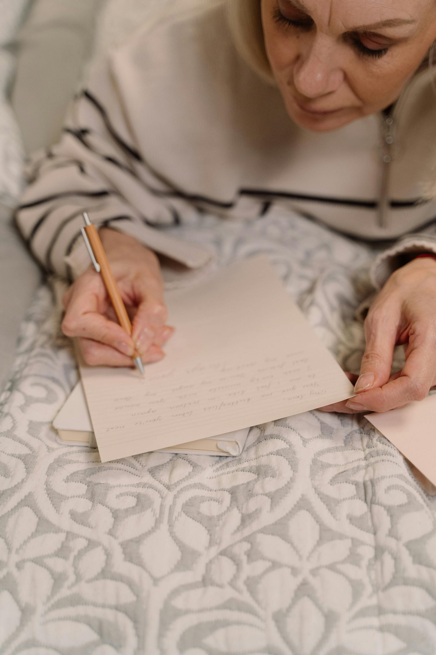 A person writing a letter | Source: Pexels