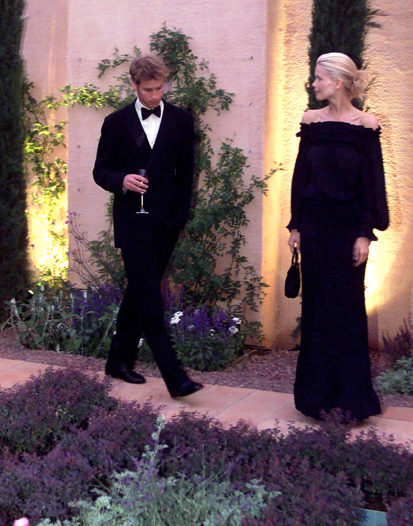 A candid pause between conversations saw Prince William and Claudia Schiffer momentarily locked in a glance under the garden lights at Highgrove. The young royal kept his head slightly bowed, echoing the shy demeanour he once described from their first meeting.