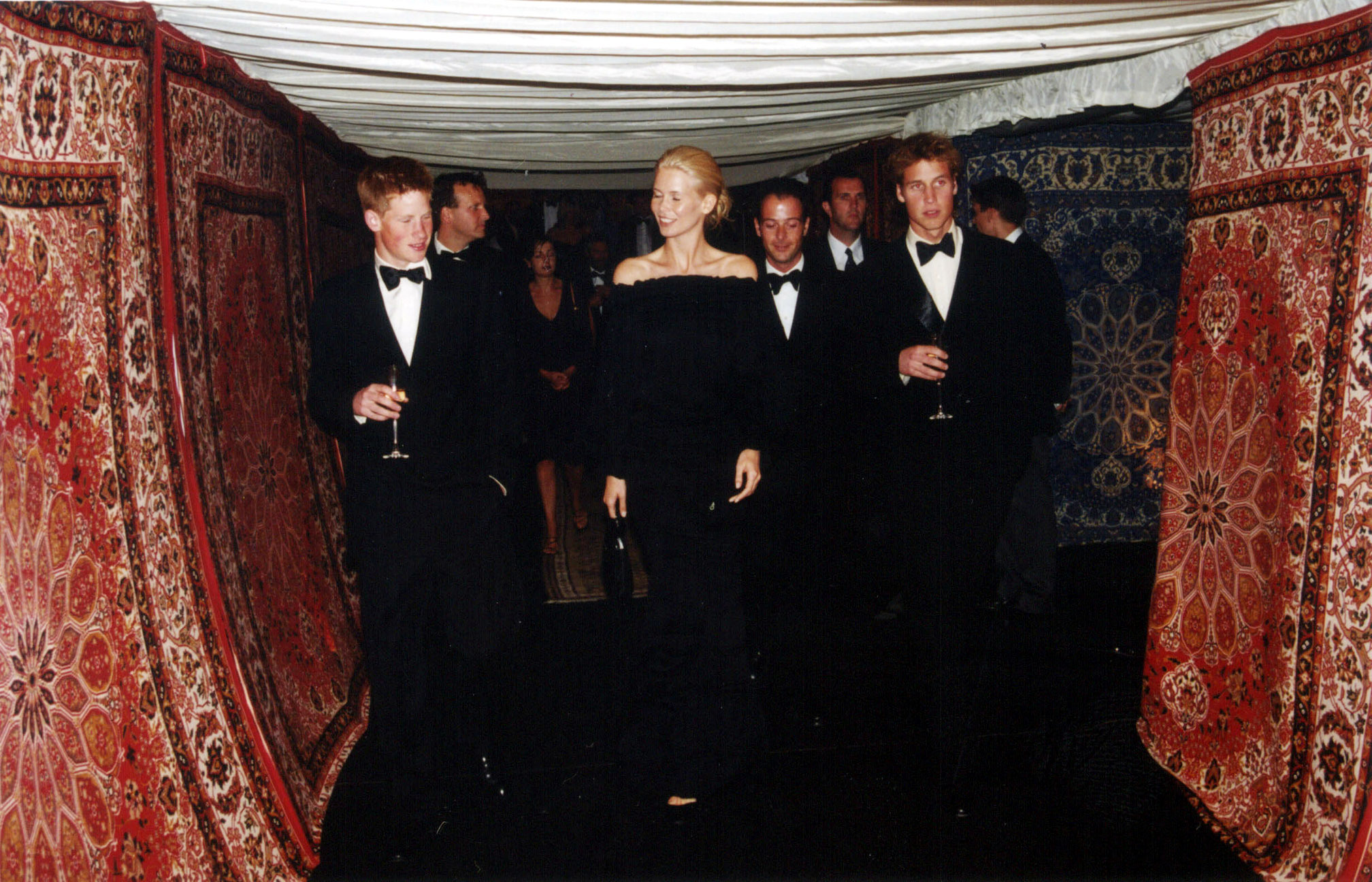 Claudia Schiffer was flanked by Prince Harry and Prince William as they made their way through an ornate tented corridor, lined with Persian carpets. The trio were among a select group attending the private gathering hosted at Highgrove.