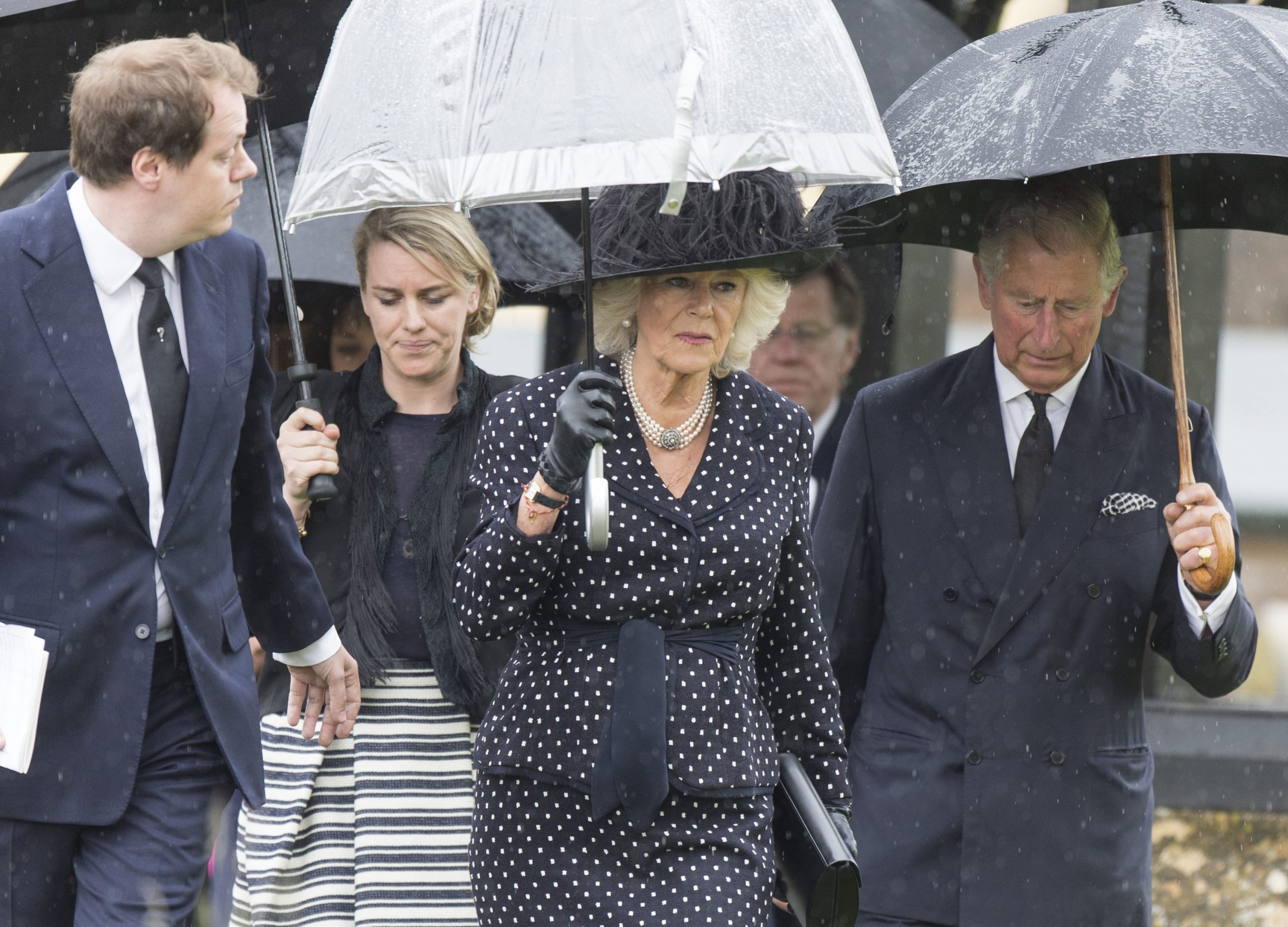 Tom Parker Bowles, Laura Lopes, Queen Camilla, and King Charles III at the funeral of Mark Shand at Holy Trinity Church on May 1, 2014, in England. | Source: Getty Images