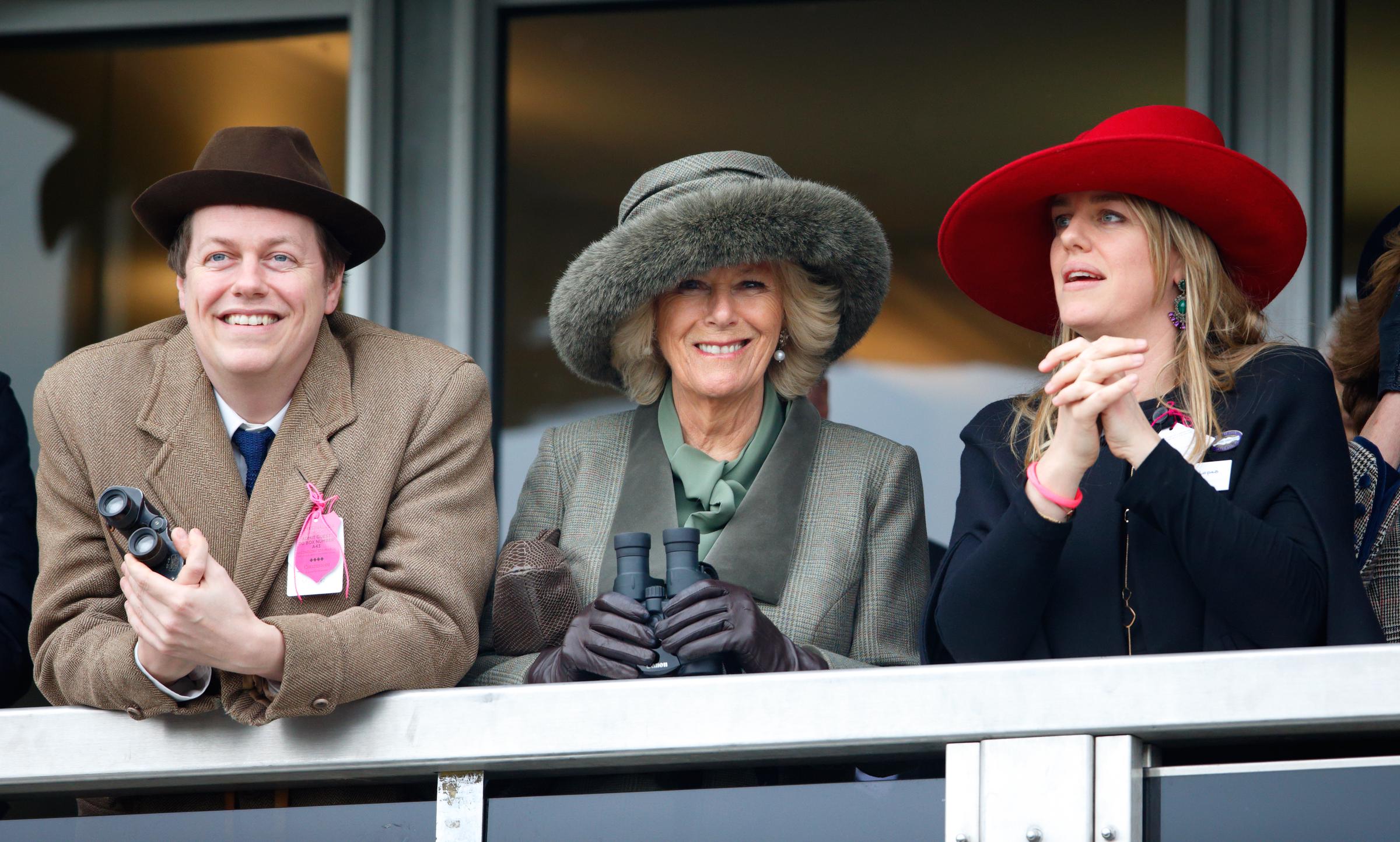 Tom Parker Bowles, Queen Camilla, and Laura Lopes during Day Two of the Cheltenham Festival at Cheltenham Racecourse on March 11, 2015, in England. | Source: Getty Images