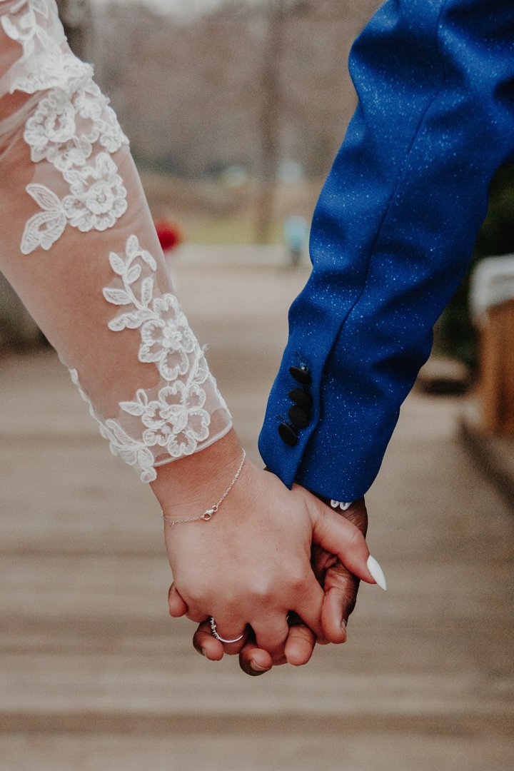 A bride and groom holding hands | Source: Unsplash