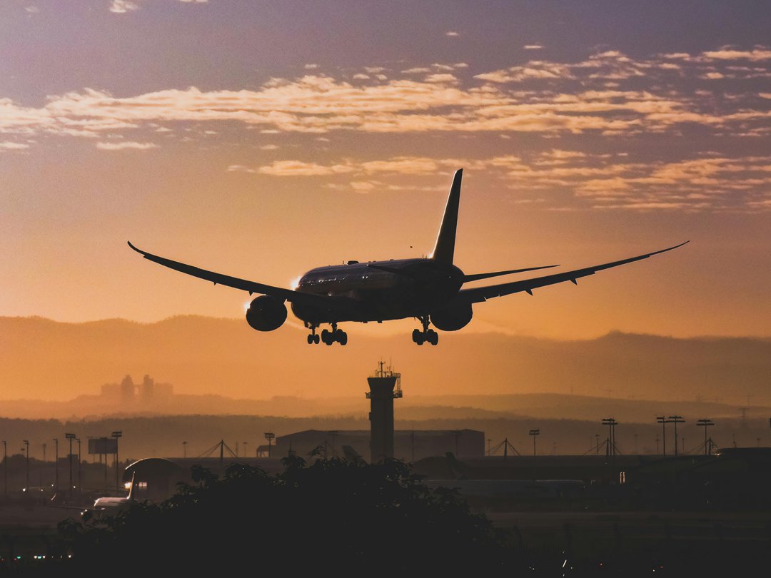 Plane landing during sunset | Source: Pexels