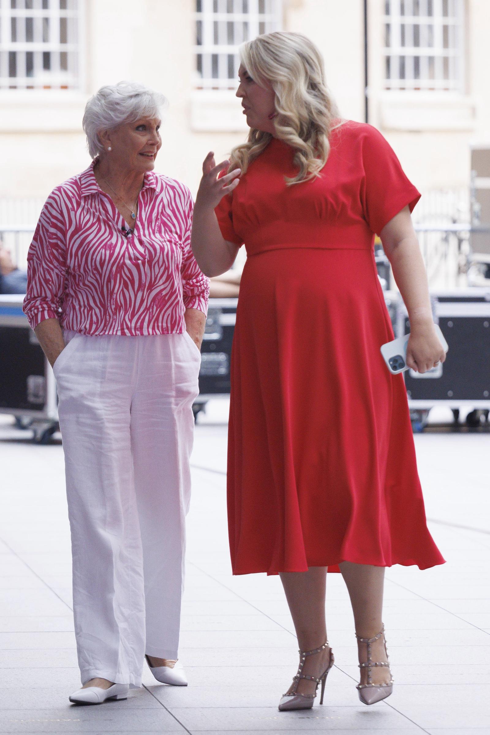 Star support! Davies shares a lively exchange with broadcasting legend Angela Rippon as the pair are spotted leaving BBC Broadcasting House in London on 4 August 2023. The outing comes just hours after Rippon was revealed as a contestant for the then-upcoming 