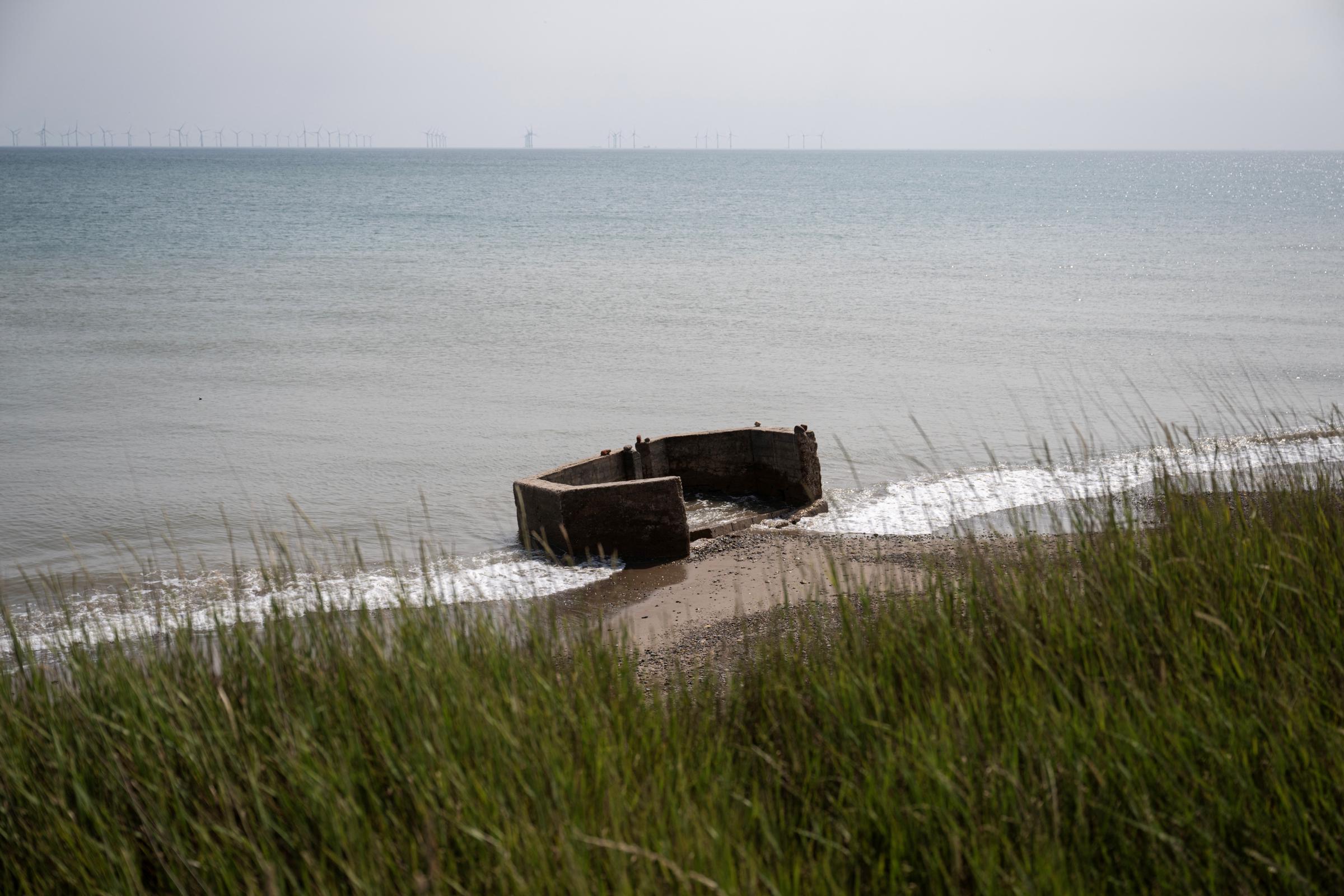Remnants of World War defences, formerly on a cliff top, lie on the beach after coastal erosion has seen the cliff edge retreat significantly near Withernsea in the East Riding of Yorkshire, England, photographed on June 17, 2025. | Source: Getty Images