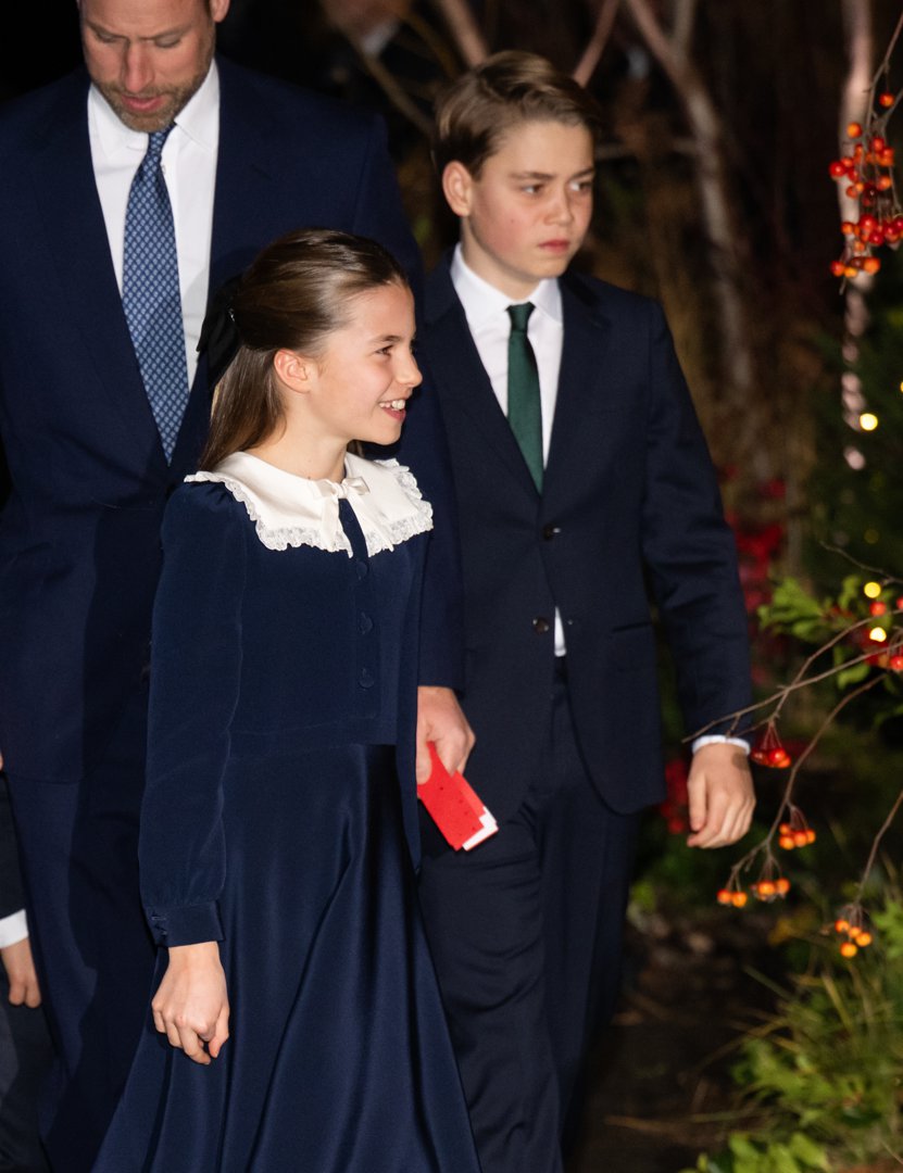 Walking just ahead of their father, Princess Charlotte smiled warmly while holding a red programme, as Prince George kept a focused gaze. Their poised demeanour and smart tailoring offered a rare glimpse into the quietly growing confidence of the next generation of royals.