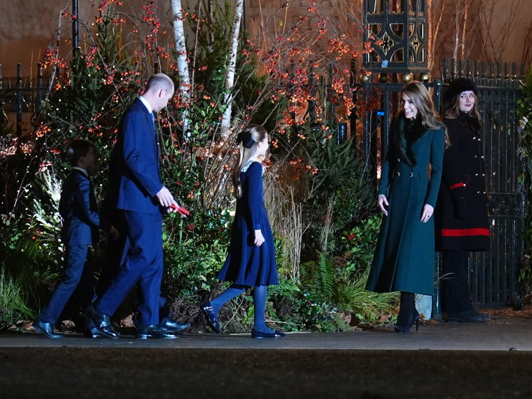 With Catherine, Princess of Wales, waiting near the gate in her emerald Catherine Walker coat, the rest of the Wales family &mdash; led by Princess Charlotte &mdash; makes their way toward her. The moment captured a warm, anticipatory energy, as the five gathered ahead of the festive carol service.