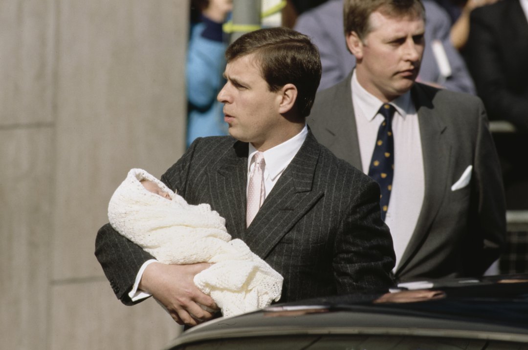 Andrew Mountbatten-Windsor leaving the Portland Hospital with his daughter, Princess Eugenie, on March 30, 1990, in London, England. | Source: Getty Images