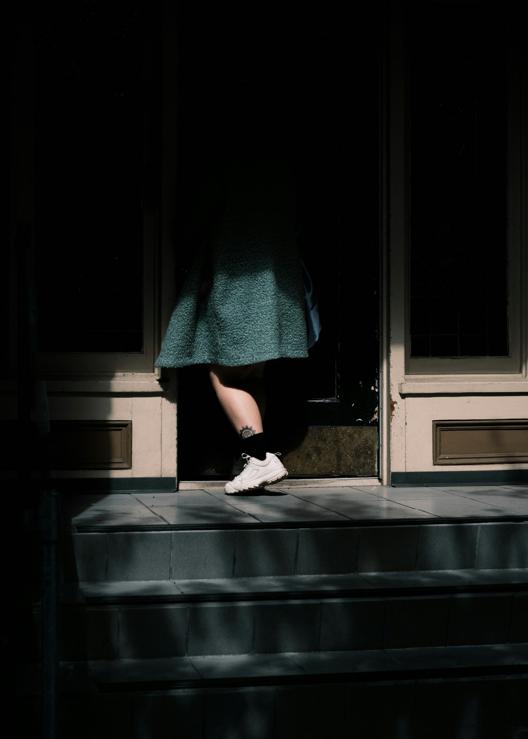 A female sneaking out of a house at night | Source: Unsplash