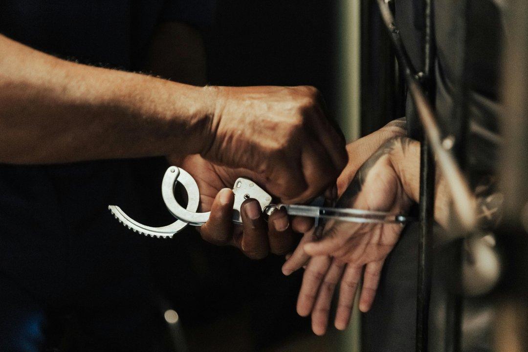 A woman being released from handcuffs | Source: Pexels