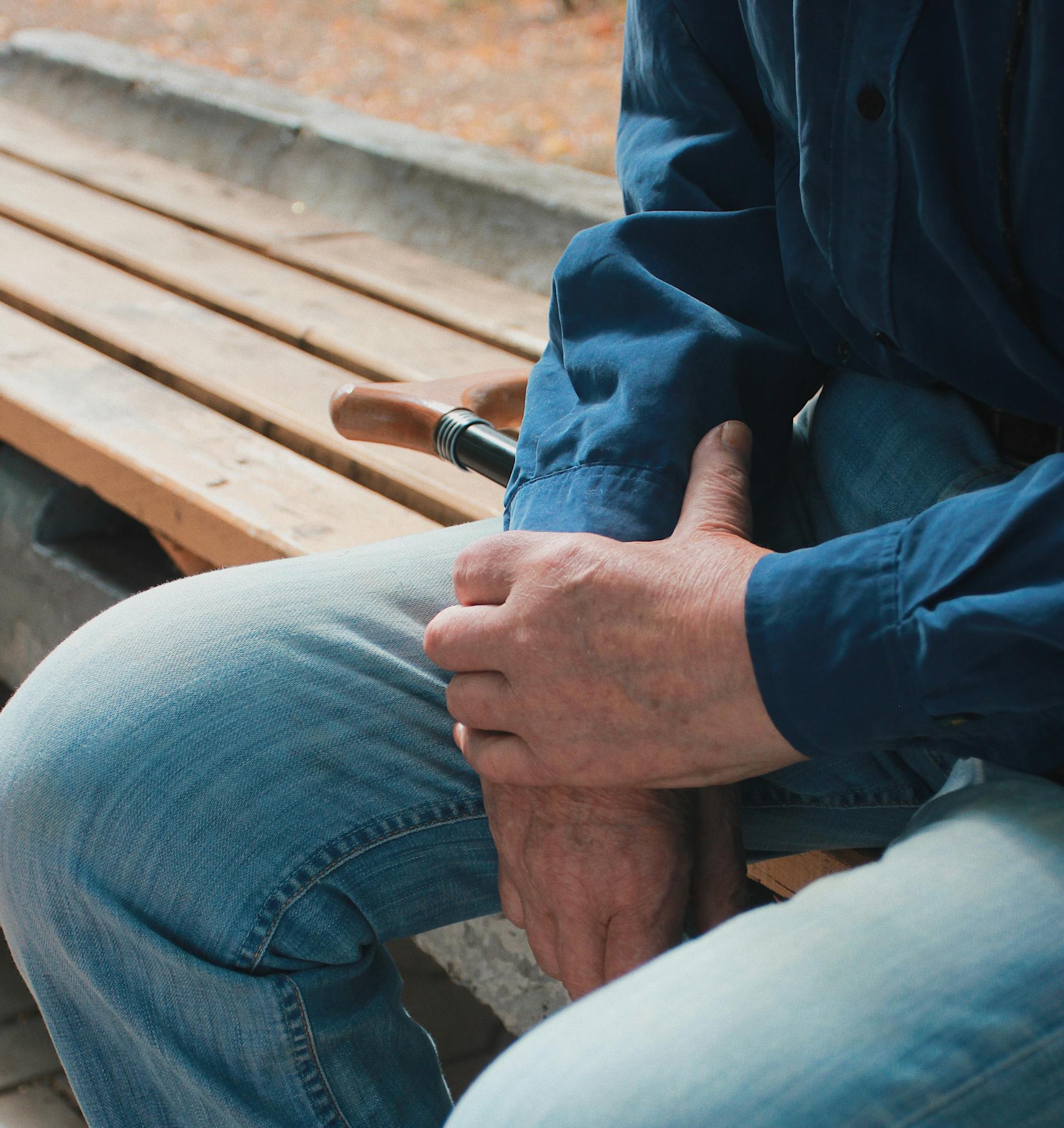 A close-up shot of a man sitting on a bench | Source: Pexels