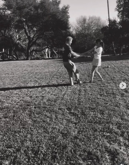 The Duke and Duchess of Sussex hold hands mid-spin on their lawn in a moment captured from a video post dated January 17, 2026. | Source: Instagram/meghan