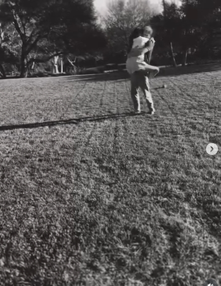 Prince Harry lifts Meghan Markle off the ground during a playful dance in their garden, as seen in a video shared in a post dated January 17, 2026. | Source: Instagram/meghan