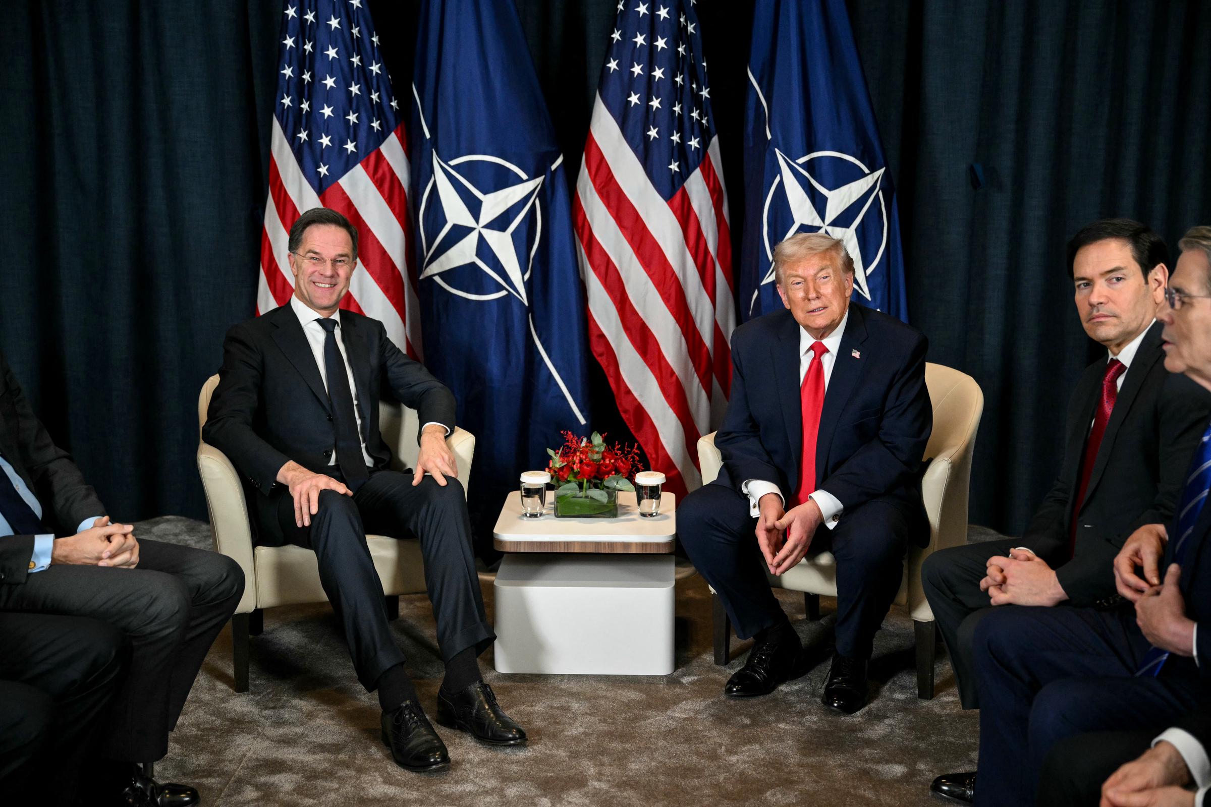 US President Donald Trump (C-R) speaks with NATO's Secretary-General Mark Rutte (L) next to US Secretary of State Marco Rubio (2R) during a bilateral meeting on the sidelines of the World Economic Forum (WEF) annual meeting on 21 January 2026 in in Davos, Switzerland. | Source: Getty Images