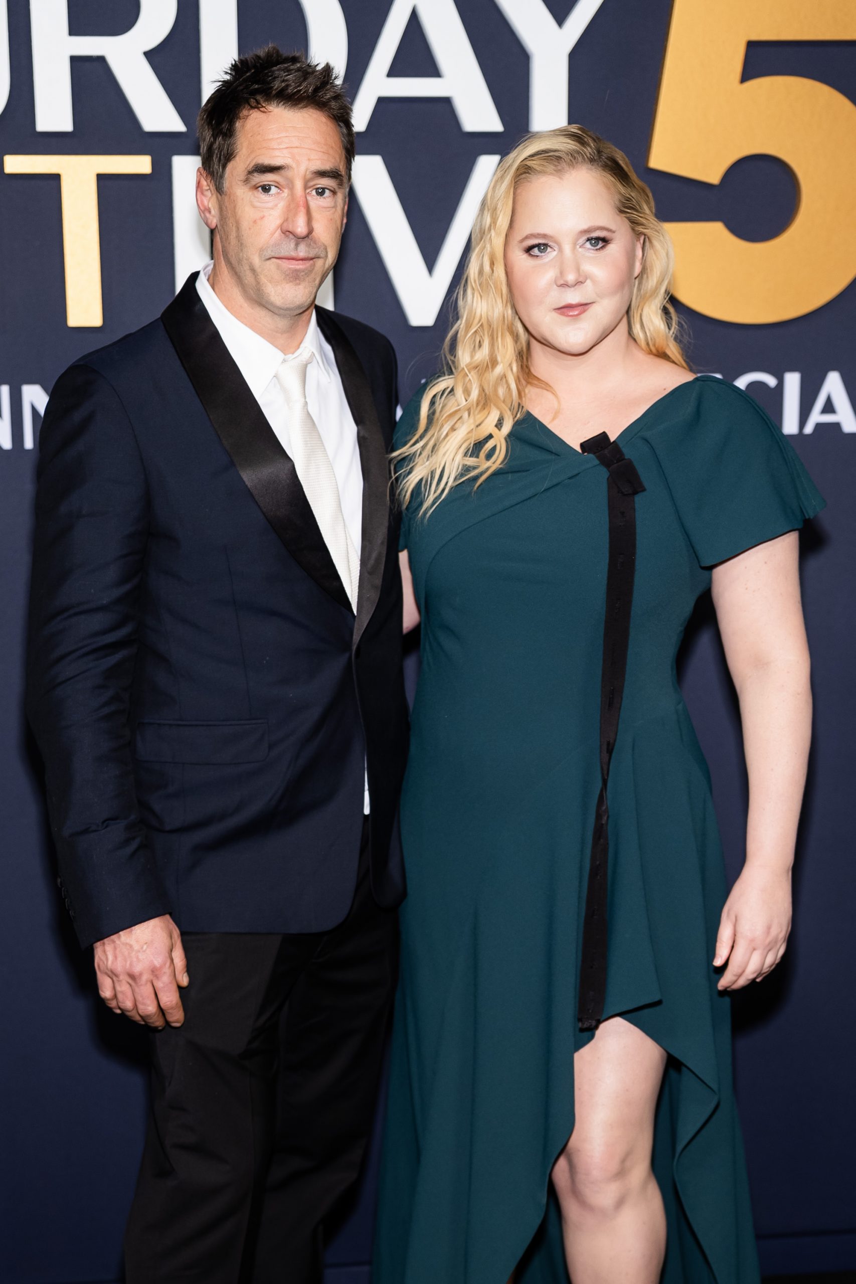 Amy Schumer posed alongside then-husband Chris Fischer at the 