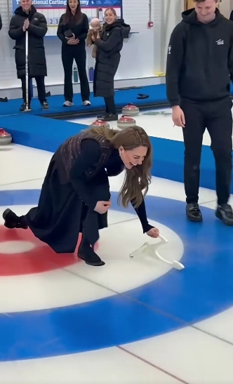 Princess Kate reacted with a mix of laughter and relief after completing her first curling attempt at the National Curling Academy in Stirling. Still kneeling on the ice and gripping the handle used to stabilise her slide, she shared a light moment with instructors as onlookers applauded her effort. | Source: TikTok/hellomag