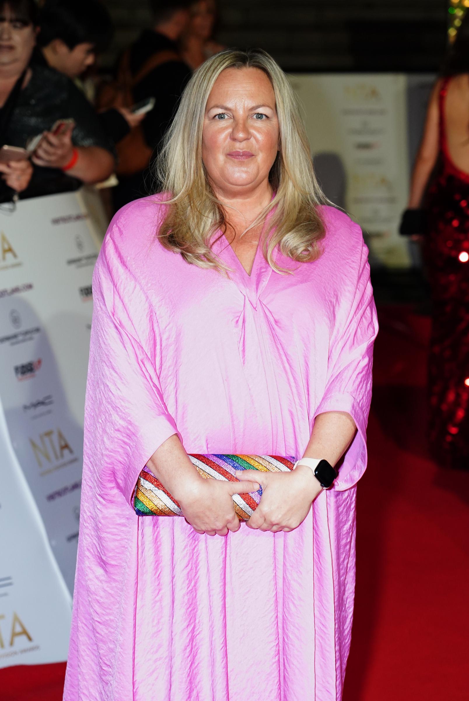 Stanley brings the glam to the 2022 National Television Awards at London's OVO Arena Wembley. Draped in flowing pink, she adds a burst of colour to the celebrity-studded celebration of British telly.