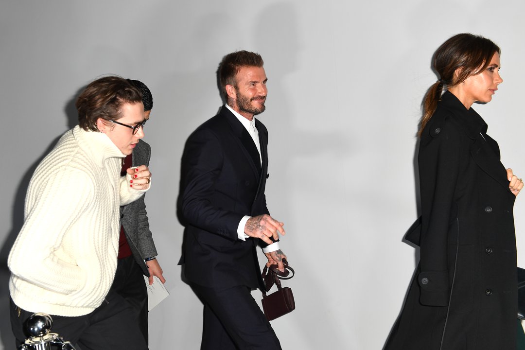 Brooklyn Peltz Beckham with David and Victoria Beckham at the Dior fashion show during Paris Fashion Week on January 17, 2020, in France. | Source: Getty Images