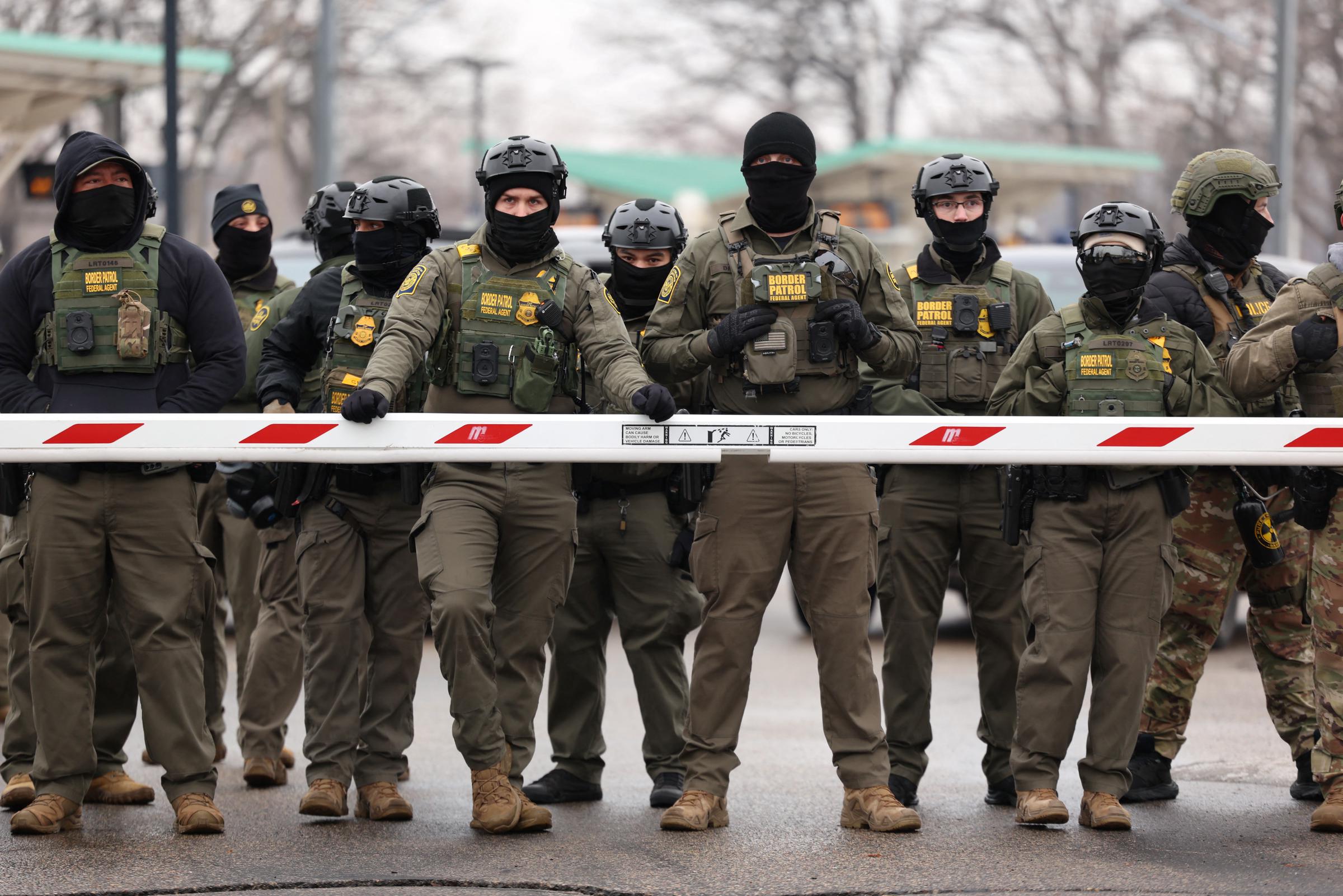 Border Patrol agents stand guard at the Bishop Henry Whipple Federal Building in Minneapolis, Minnesota, on January 8, 2026 | Source: Getty Images