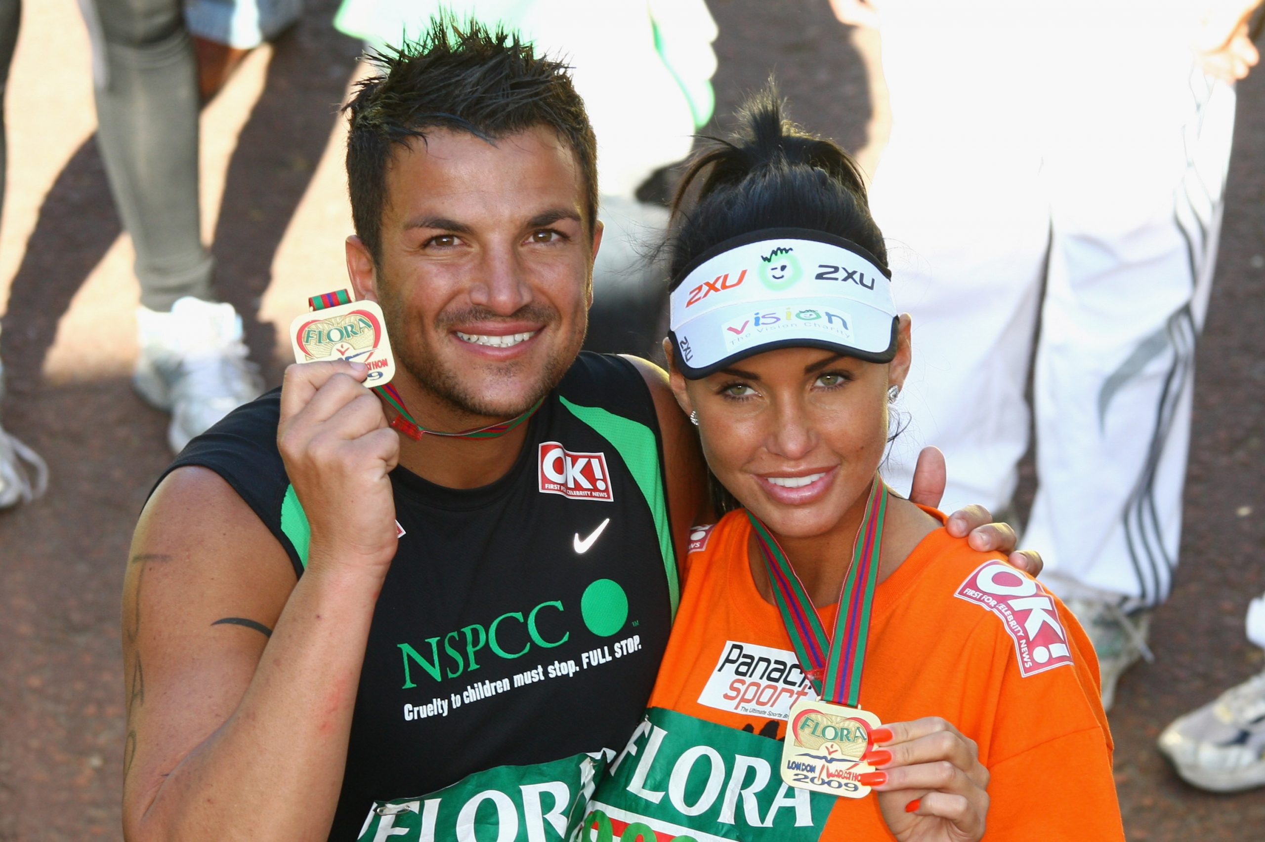 Peter Andre and Katie Price pose after they completed the 2009 Flora London Marathon on April 26 in London, England. | Source: Getty Images
