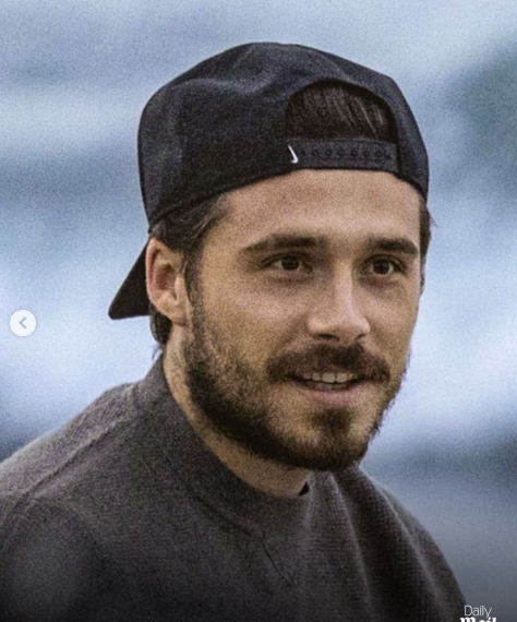 Brooklyn Peltz Beckham pictured in Malibu wearing a backwards Nike cap and brown sweater during a beach outing with Nicola Peltz Beckham from a post dated January 22, 2026. | Source: Instagram/dailymailuk