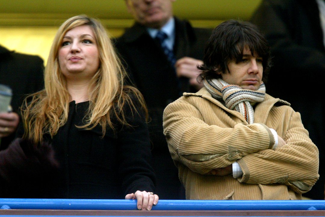 A Power Couple in the Stands: Karren Brady, then chief executive of Birmingham City, locks eyes on the pitch beside her husband, Derby County's Paul Peschisolido, as they take in the high-stakes clash between Birmingham and Chelsea on 30 January 2005. Both sit riveted in the stands — a picture of football royalty watching their worlds collide.