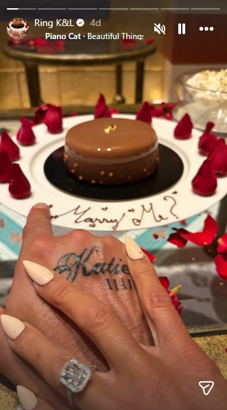 Lee Andrews and Katie Price hold hands in a celebratory moment following their engagement, with a dessert plate and rose petals spelling out the proposal in an Instagram Story posted on January 23, 2026. | Source: Instagram/wesleeeandrews