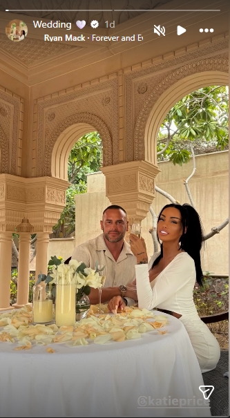 Lee Andrews and Katie Price pose together at their wedding table in Dubai, surrounded by floral arrangements and rose petals following their surprise marriage. | Source: Instagram/wesleeeandrews