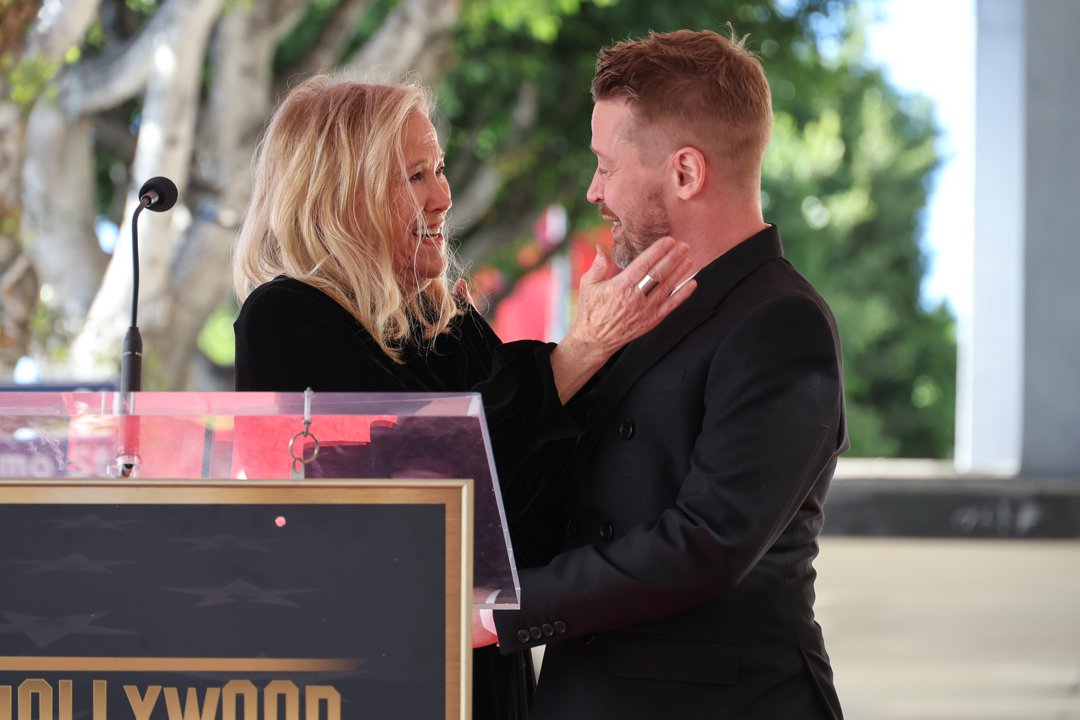 Catherine O'Hara and Macaulay Culkin speak onstage during the ceremony honoring Macaulay Culkin with a Star on the Hollywood Walk of Fame | Source: Getty Images