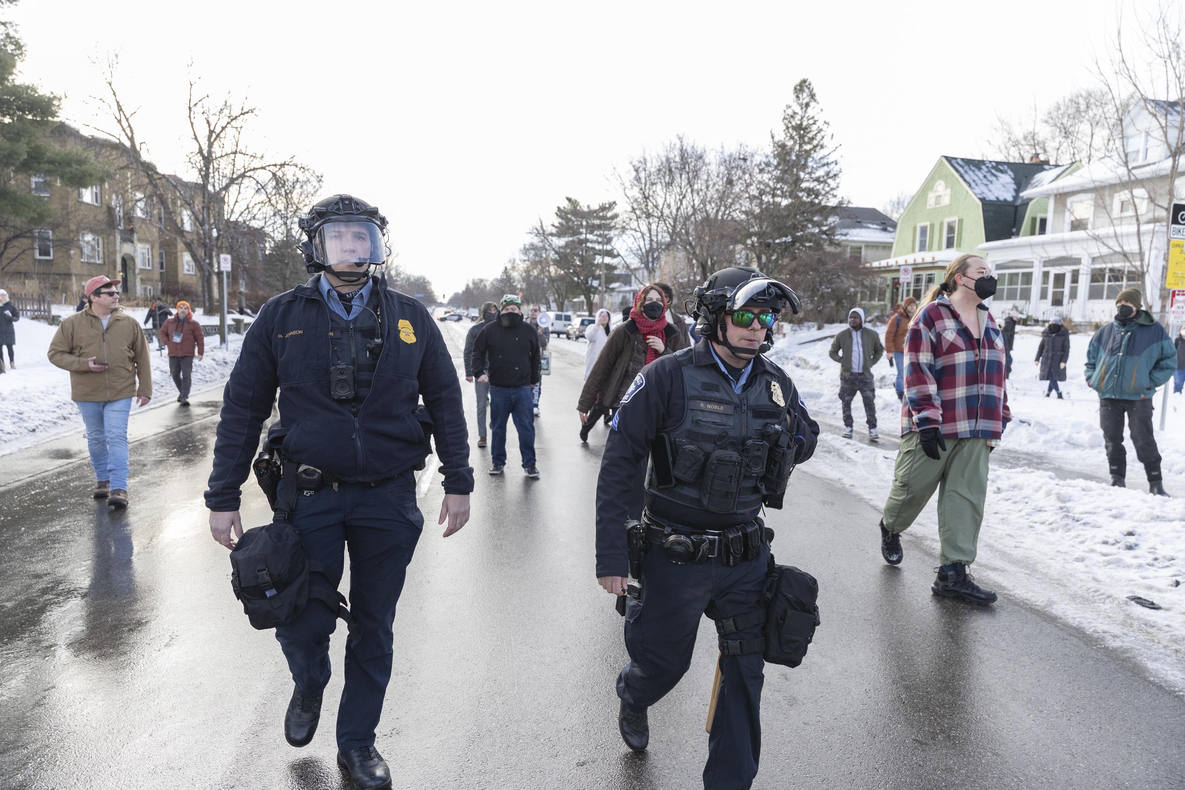 ICE agents walk near the scene of a fatal shooting involving a federal officer in south Minneapolis on January 7, 2026 | Source: Getty Images