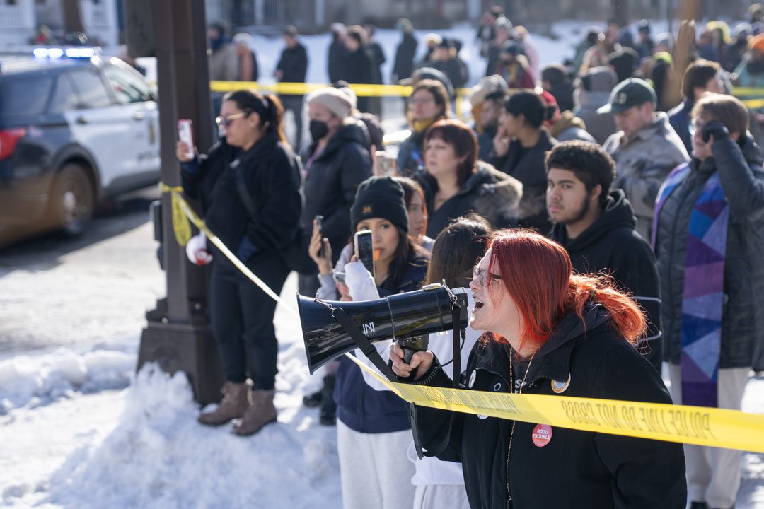 Community members and protesters gather near the site of the ICE-involved fatal shooting in Minneapolis | Source: Getty Images