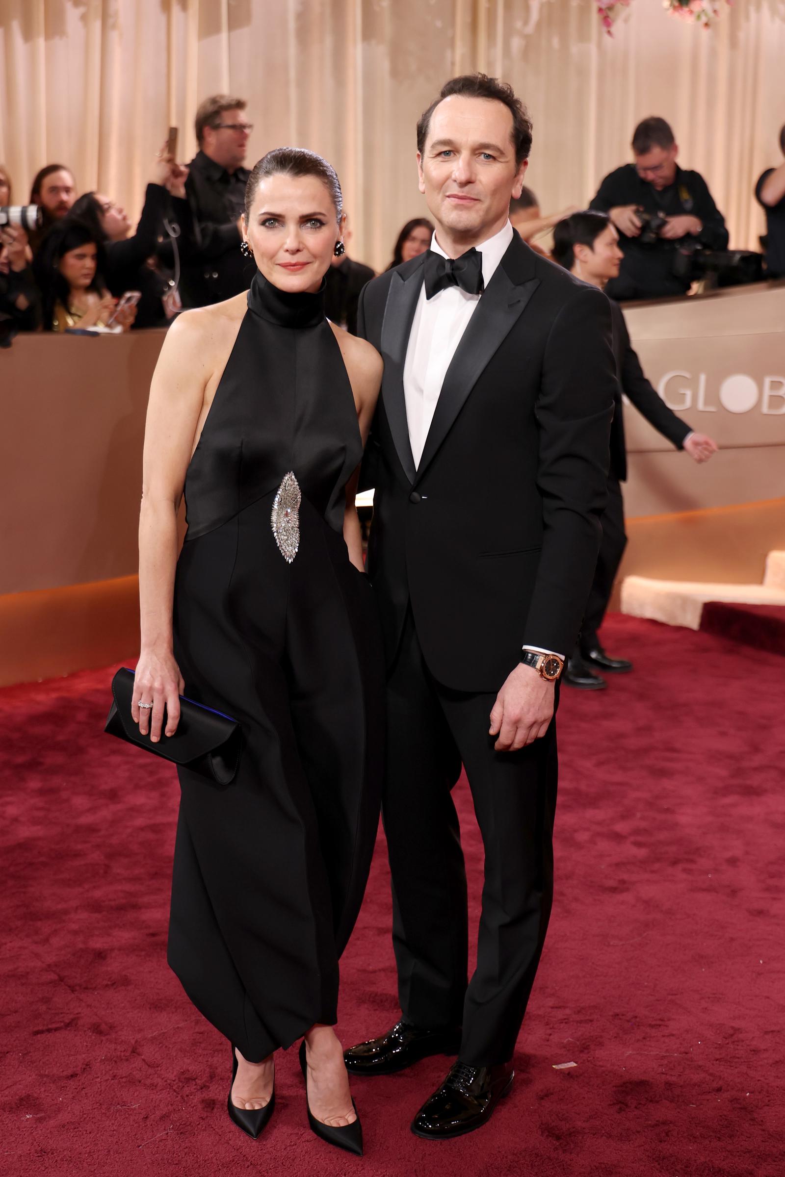 Keri Russell and Matthew Rhys Share a Chic Red Carpet Moment: Real-life couple Keri Russell and Matthew Rhys delivered double the style in coordinated black ensembles at the Golden Globes. Posing arm in arm, the pair radiated Hollywood poise and partnership &mdash; a picture of Hollywood royalty at one of the year's most glamorous nights.