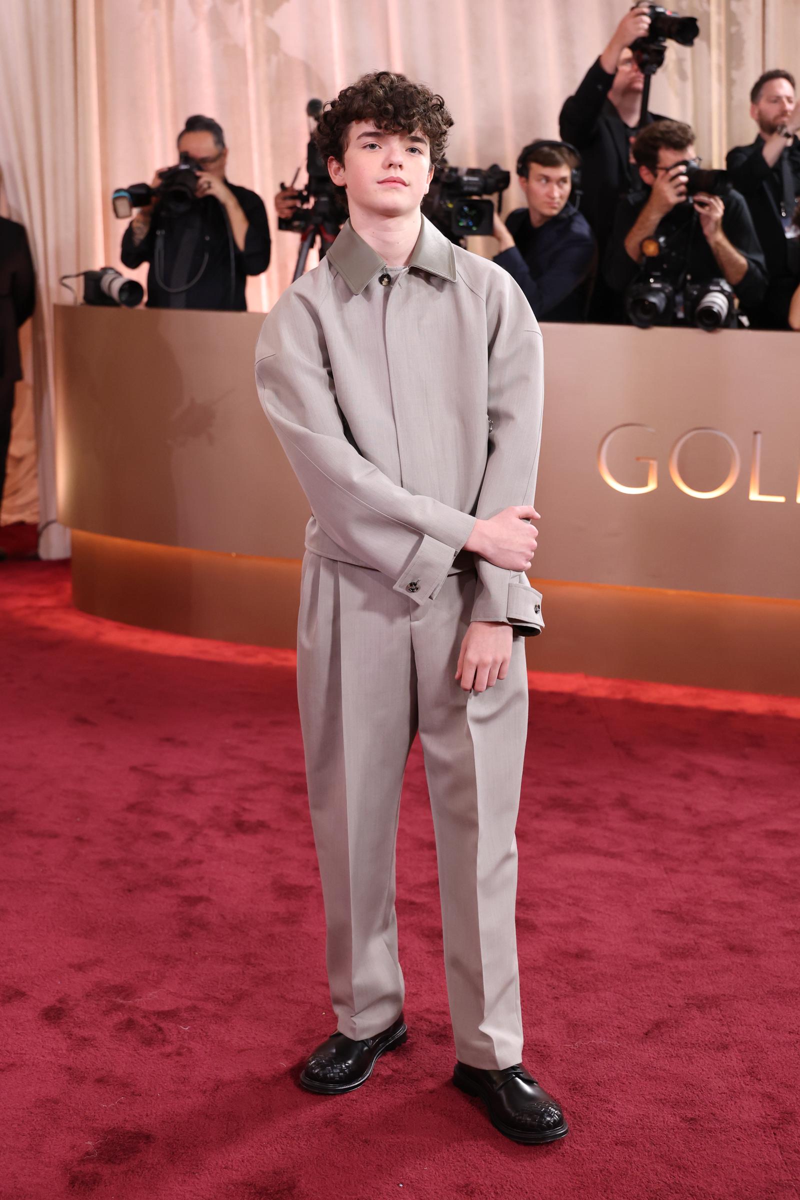 Owen Cooper Makes History with Cool Confidence: At just 16, Owen Cooper made a poised entrance in a softly tailored neutral suit &mdash; composed, assured, and ready for the spotlight. The youngest winner in Golden Globes history looked every bit the rising star as he faced the cameras with quiet grace.
