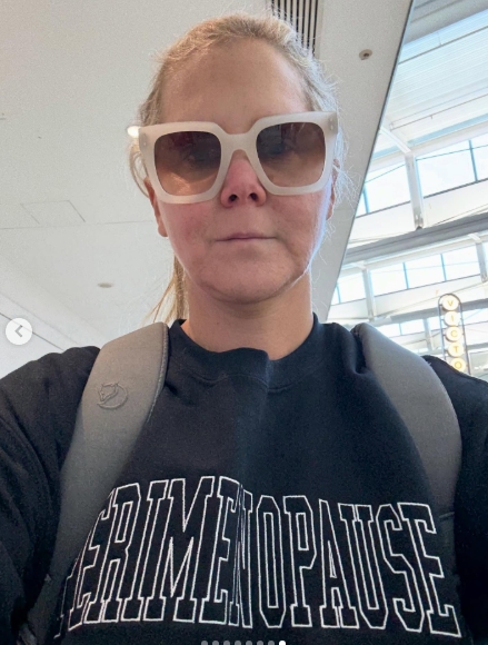 Amy Schumer snapped a no-makeup selfie while wearing oversized white sunglasses and a sweatshirt that boldly read 