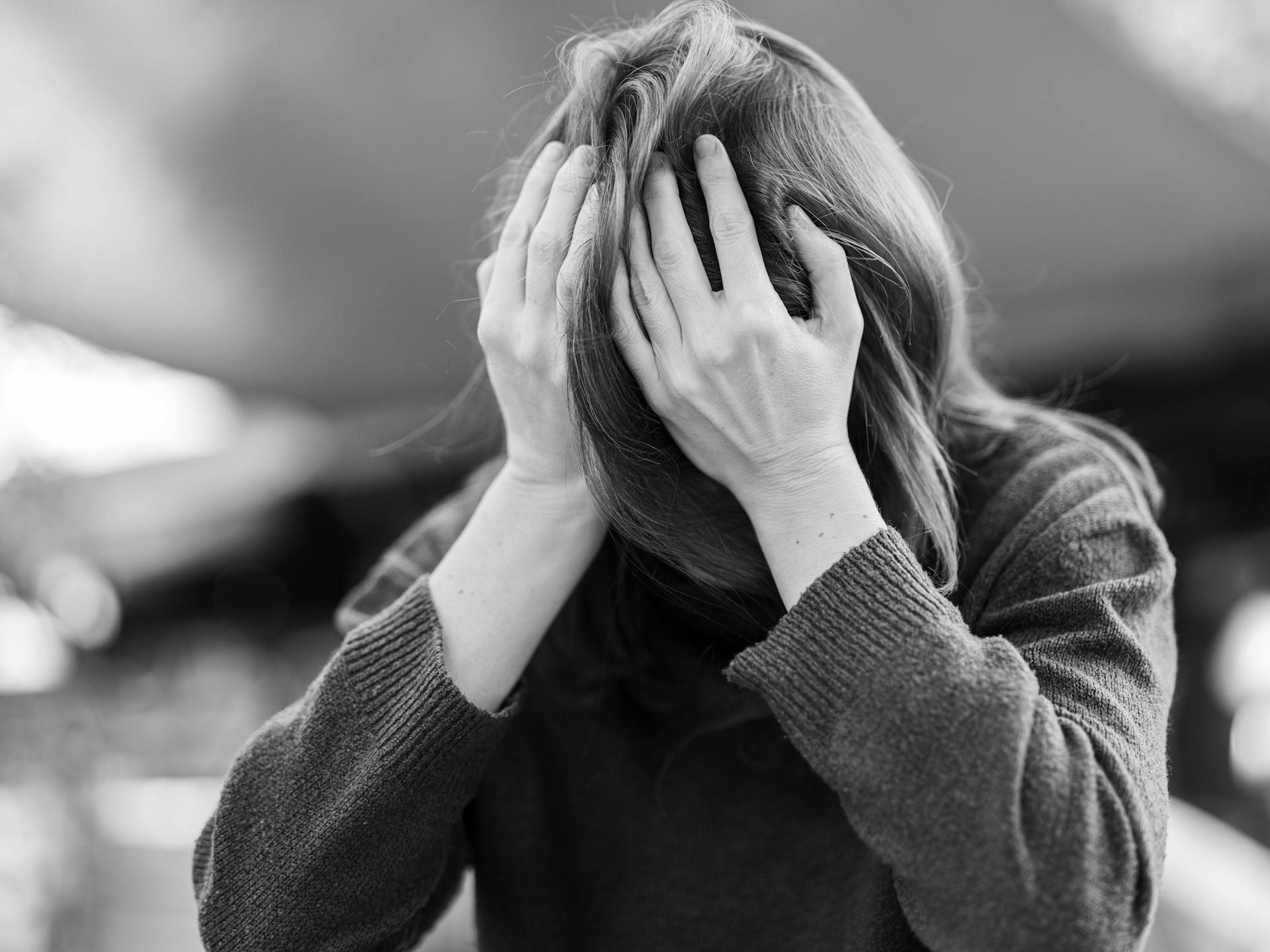 Grayscale photo of a depressed woman | Source: Pexels