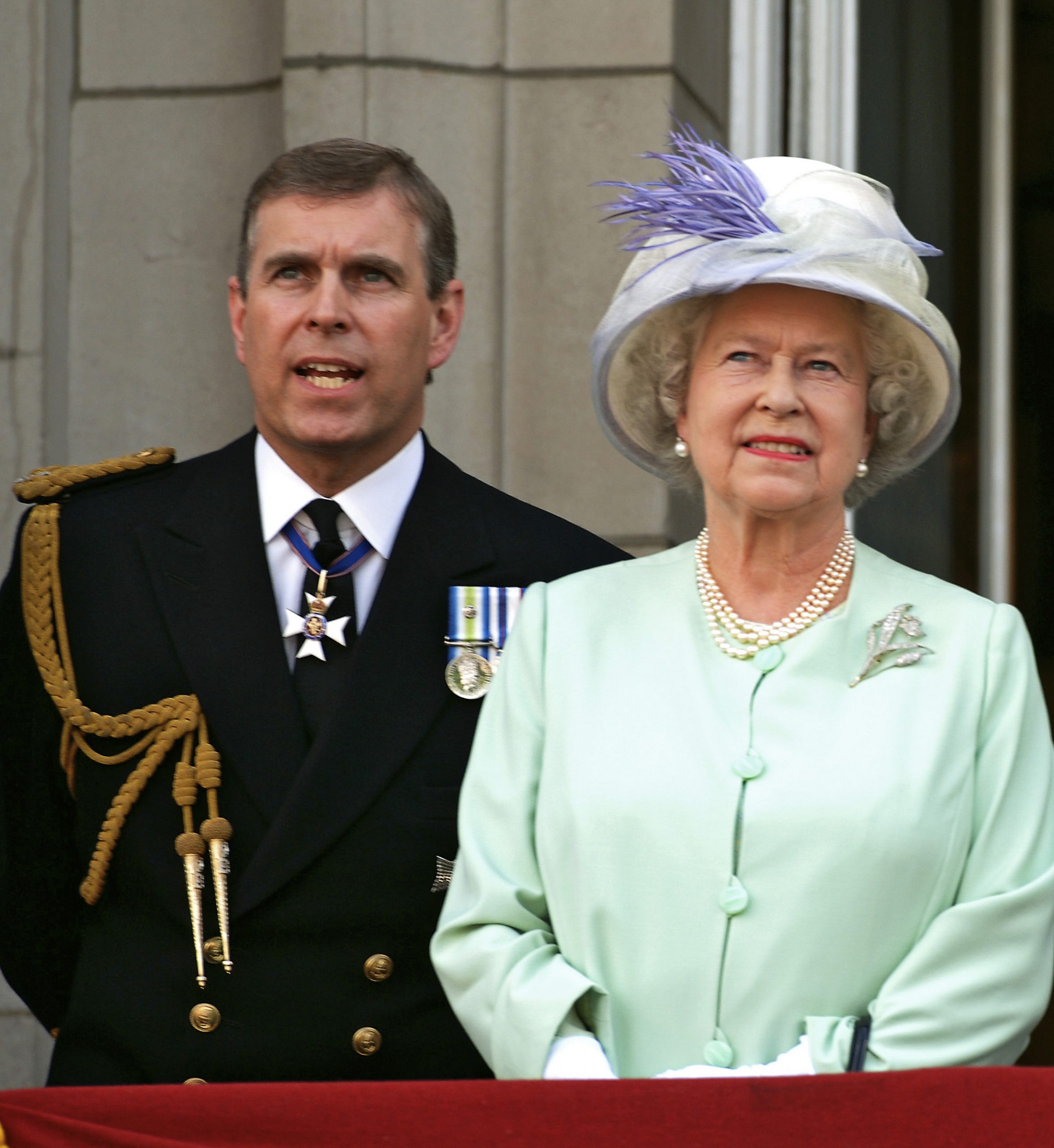 Andrew Mountbatten-Windsor and Queen Elizabeth II on the balcony of Buckingham Palace on National Commemoration Day, July 10, 2005. | Source: Getty Images