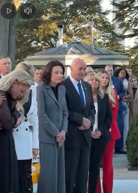 Erika Kirk wears a black dress as she stands toward the left at the Medal of Freedom Ceremony held in honor of her late husband, Charlie Kirk, from a video post dated October 14, 2025 | Source: Facebook Reel/New York Post