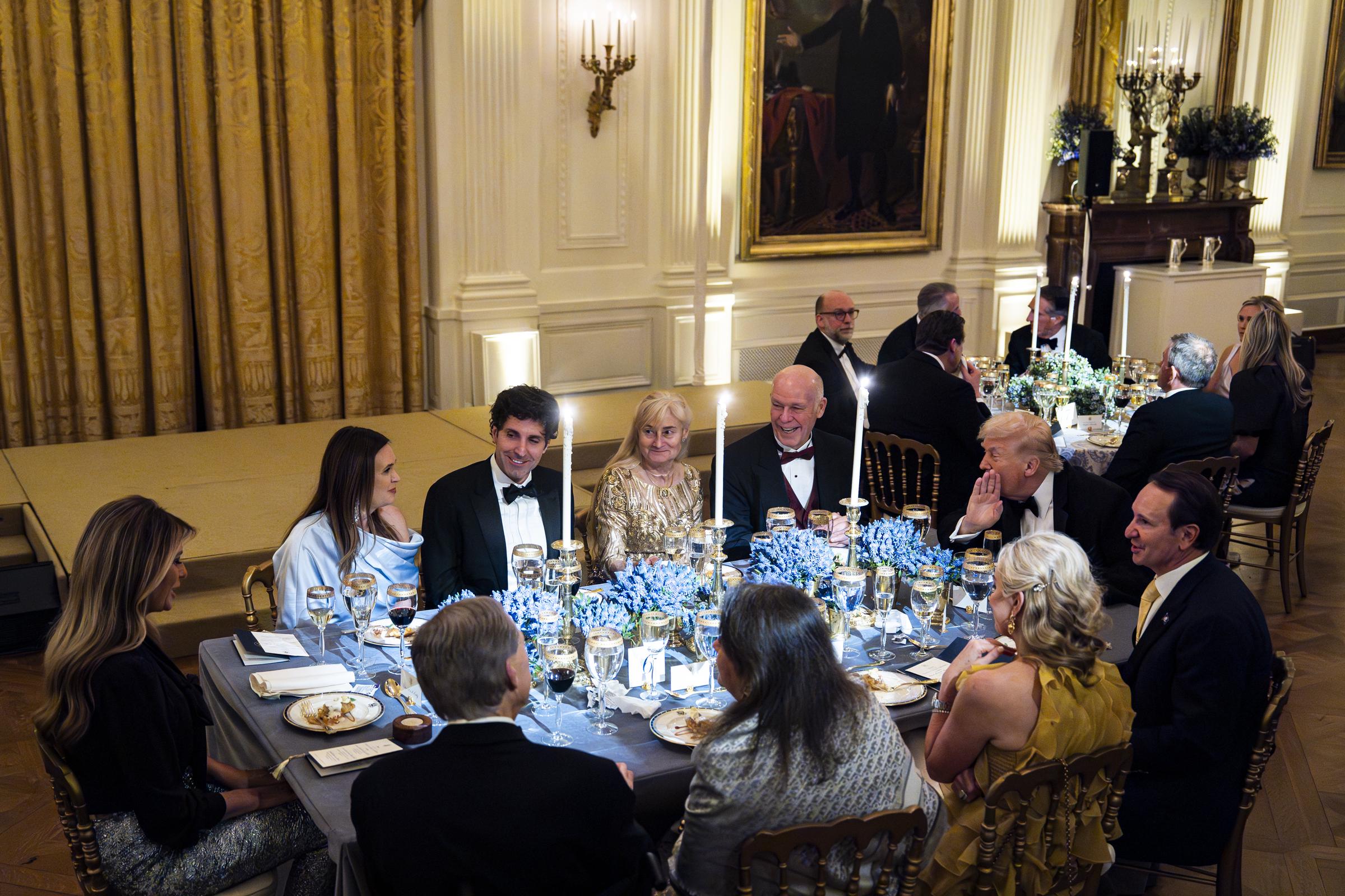 Donald Trump, Melania Trump, Sarah Huckabee Sanders, Greg Gianforte, Jeff Landry, and Greg Abbott during the National Governors Association Evening Dinner and Reception in the East Room of the White House on February 21, 2026, in Washington, DC | Source: Getty Images