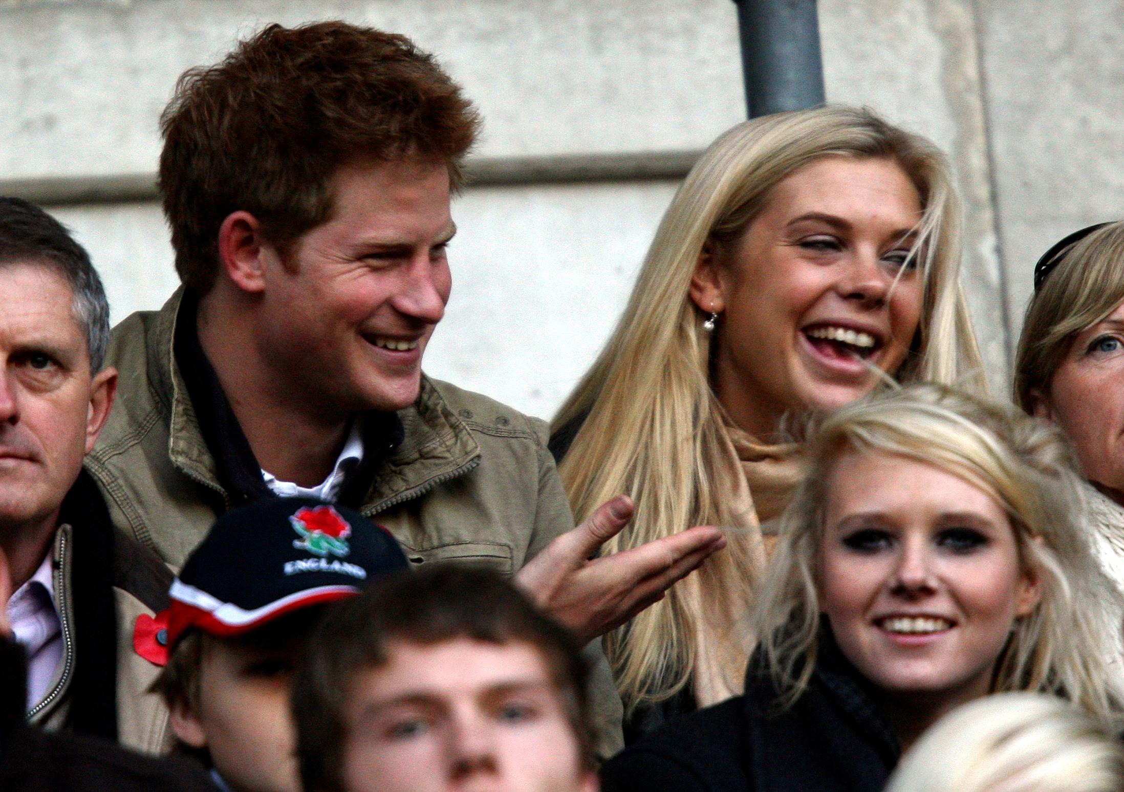 Prince Harry and Chelsy Davy watch from the stands during the Investec Challenge Series match at Twickenham Stadium, London | Source: Getty Images